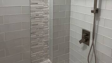 Combined shower/tub, hair dryer, towels, toilet paper