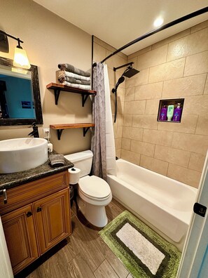 Combined shower/tub, hair dryer, towels, soap