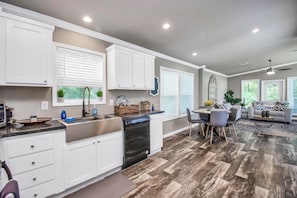 Enjoy meals in the kitchen with a dishwasher and sink, and dine at the table with comfortable seating.