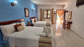 A hotel room with two beds, a TV, a desk, and a view of the outside. - Hotel HF Hacienda San Francisco (Paso de Ovejas)