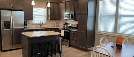Microwave, dishwasher, coffee/tea maker, cookware/dishes/utensils