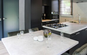 Fridge, stovetop, dishwasher, coffee/tea maker