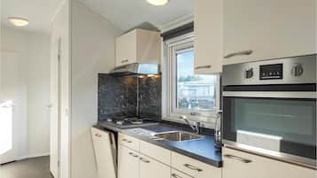 Fridge, stovetop, dishwasher, coffee/tea maker