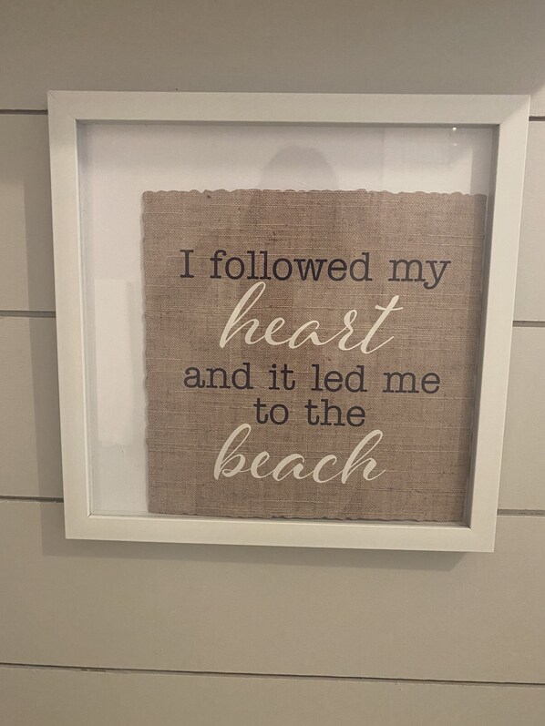 A framed inspirational quote on a textured background.