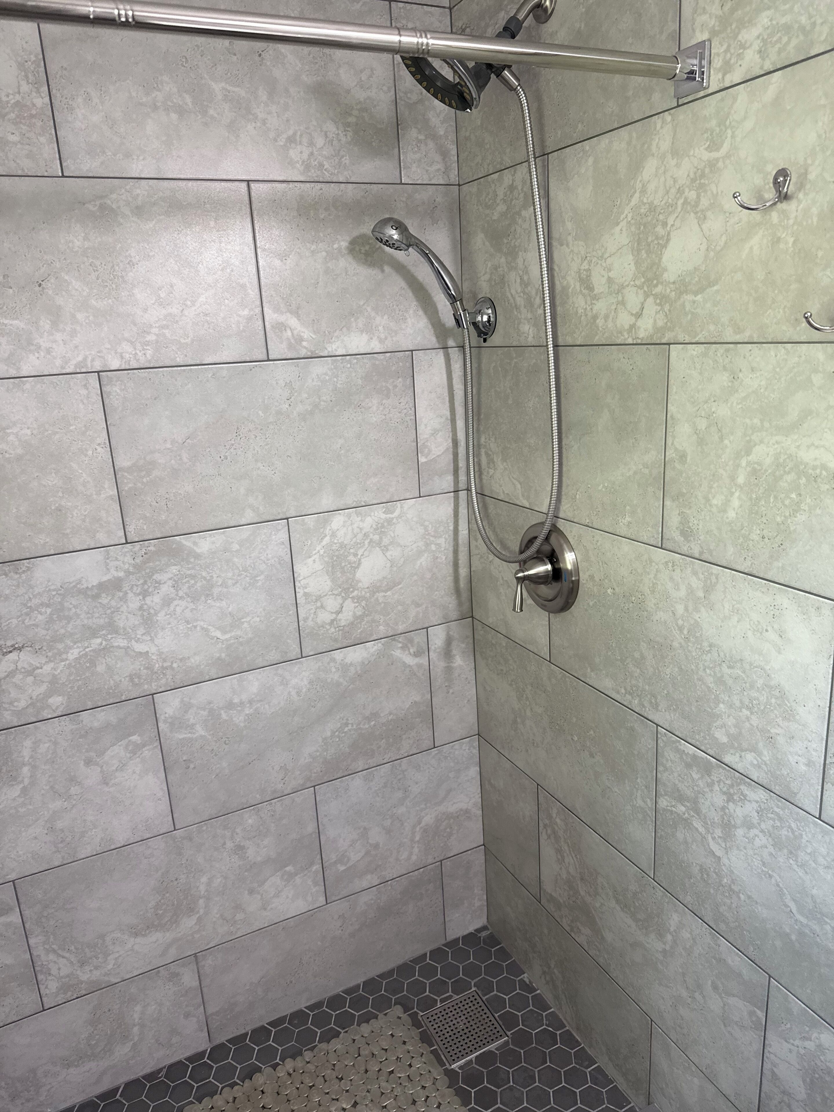 Combined shower/tub, hair dryer, towels, toilet paper