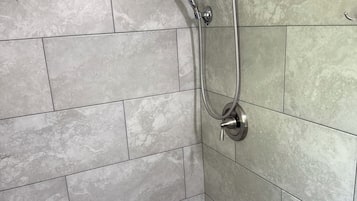 Combined shower/tub, hair dryer, towels, toilet paper