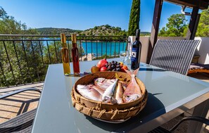 Outdoor dining - 2 bedroom beach front home in Sali (Sali)