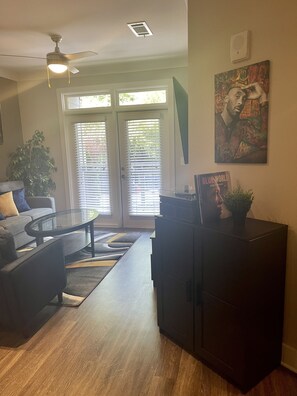 Relax in this stylish living room with a sofa, coffee table, and storage cabinet.