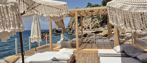 On the beach, free beach shuttle, free beach cabanas, sun-loungers