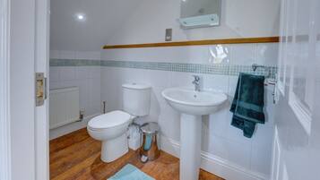 Bathtub, hair dryer, towels, soap