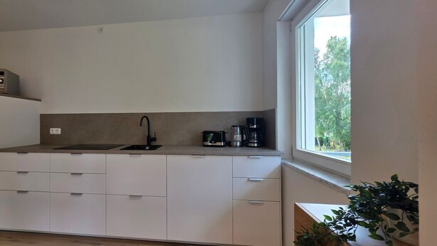 A compact kitchen with a microwave, sink, and coffee maker. - Vacation apartment A3 - close to the beach - (84 m²) - three balconies and two (Graal-Müritz)