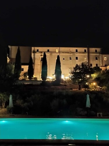 Former monastery surrounded by greenery with bright apartments, swimming pool, restaurant