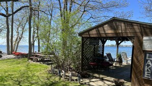 A wooden gazebo with a sign reading "Welcome to the Lake."