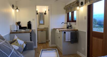 Idyllic rural Shepherds Hut in private wildflower meadow.