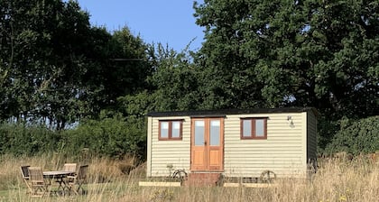 Idyllic rural Shepherds Hut in private wildflower meadow.