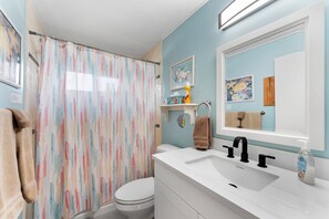Combined shower/bathtub, hair dryer, towels, soap