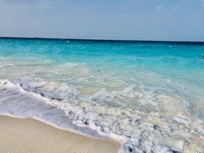 På stranden och strandhanddukar