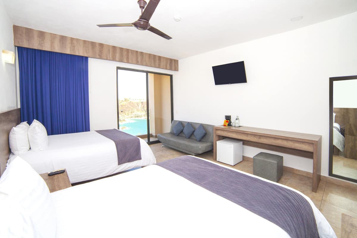 Deluxe kamer, gedeeltelijk uitzicht op oceaan | Donzen dekbedden, Select Comfort-bedden, een kluis op de kamer
