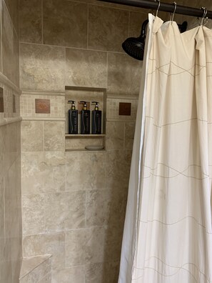 Bathtub, hair dryer, towels, soap