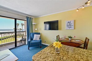Enjoy ocean views from the balcony, relax in the armchair, and unwind with a flat-screen TV.