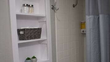 Combined shower/tub, hair dryer, towels, soap