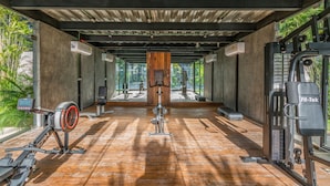 A gym with exercise equipment, large windows, and a wooden floor. - Luxury Penthouse Suite Private Pool X17 (Tulum)