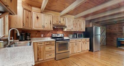 Rustic, dog-friendly cabin with deck, screened porch.