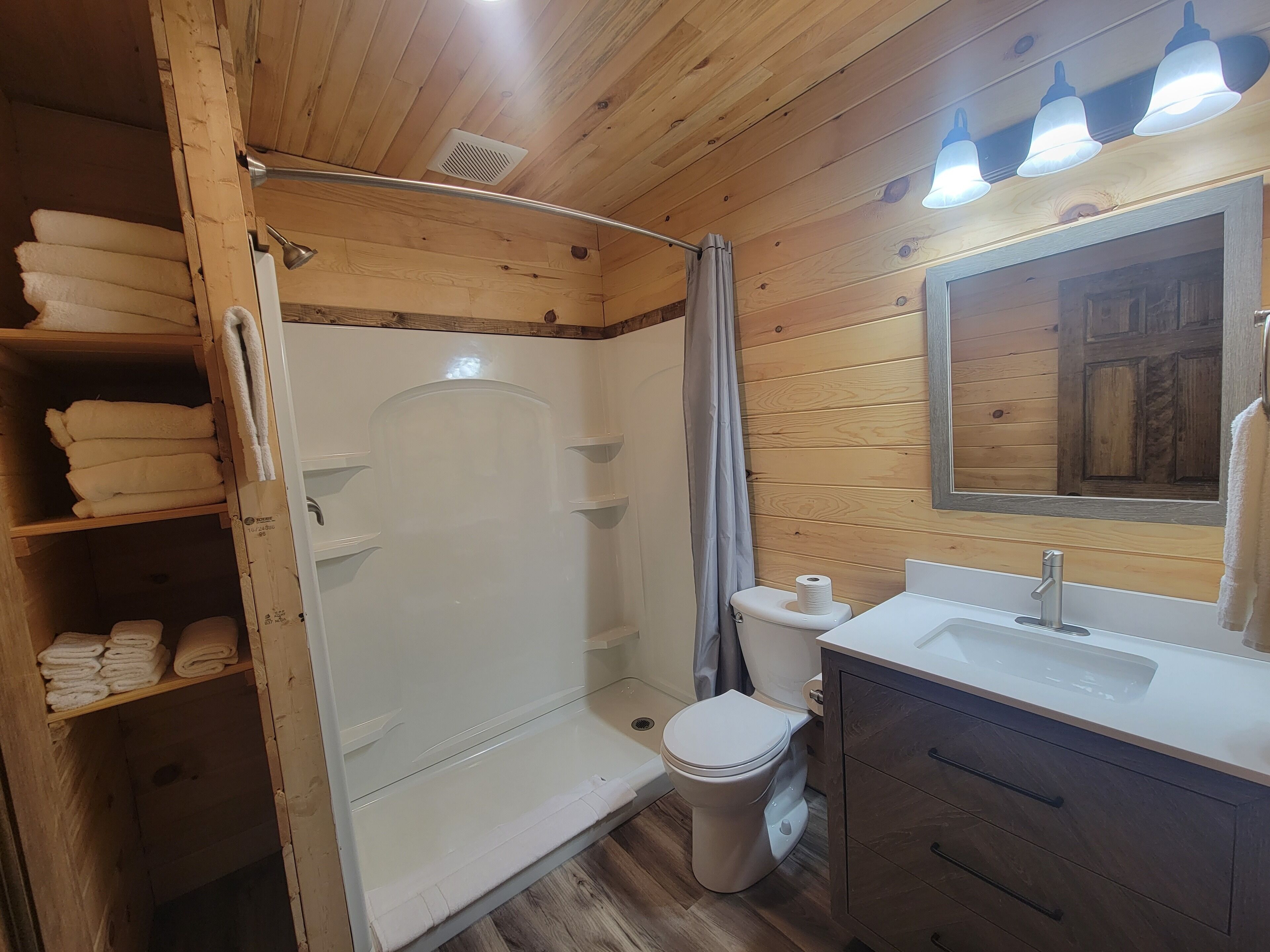Shower, towels, soap, toilet paper