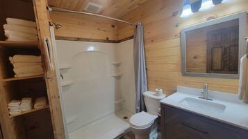 Shower, towels, soap, toilet paper