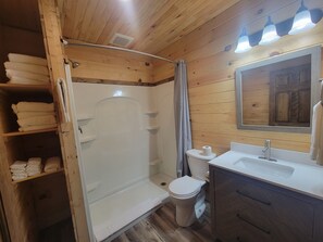 Shower, towels, soap, toilet paper