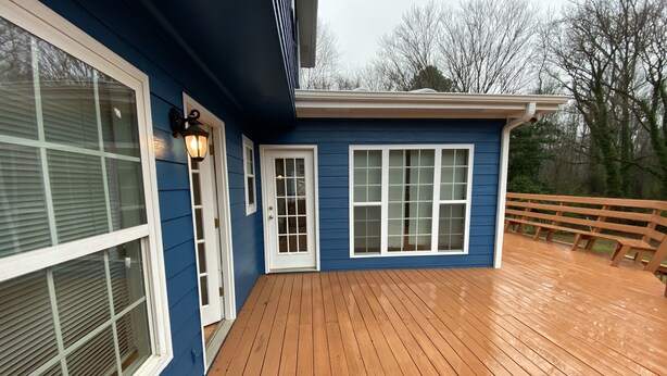 A blue house with a wooden deck and a white door. - Beautiful House 4 ENTIRE Family near Suntrust Park (Marietta)