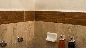 Shower, towels, soap, toilet paper
