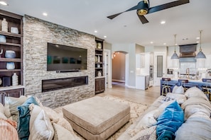 Smart TV, fireplace, books, stereo