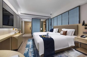 A modern hotel room with a large bed, bedside tables, a desk, and a large window. - Echarm Hotel Guangzhou Dayuan Time Plaza (Guangzhou)
