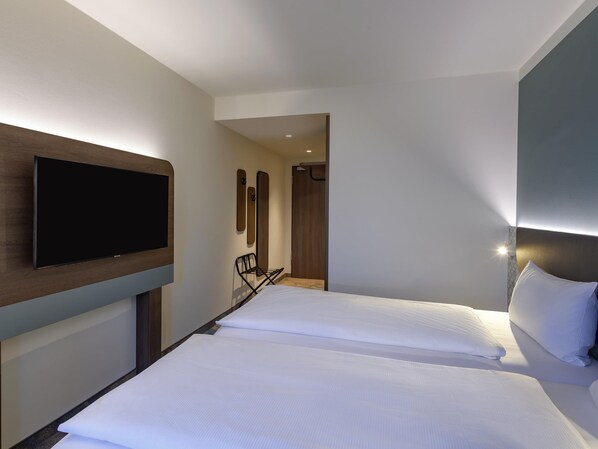 Habitació Comfort, 2 llits individuals | Roba de llit hipoal·lergògena, cortines opaques i roba de llit 