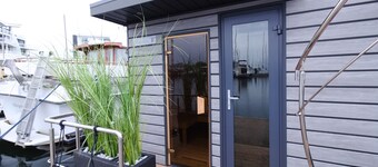 Houseboat Fjord Luna with bio-sauna and roof terrace in Wendtorf