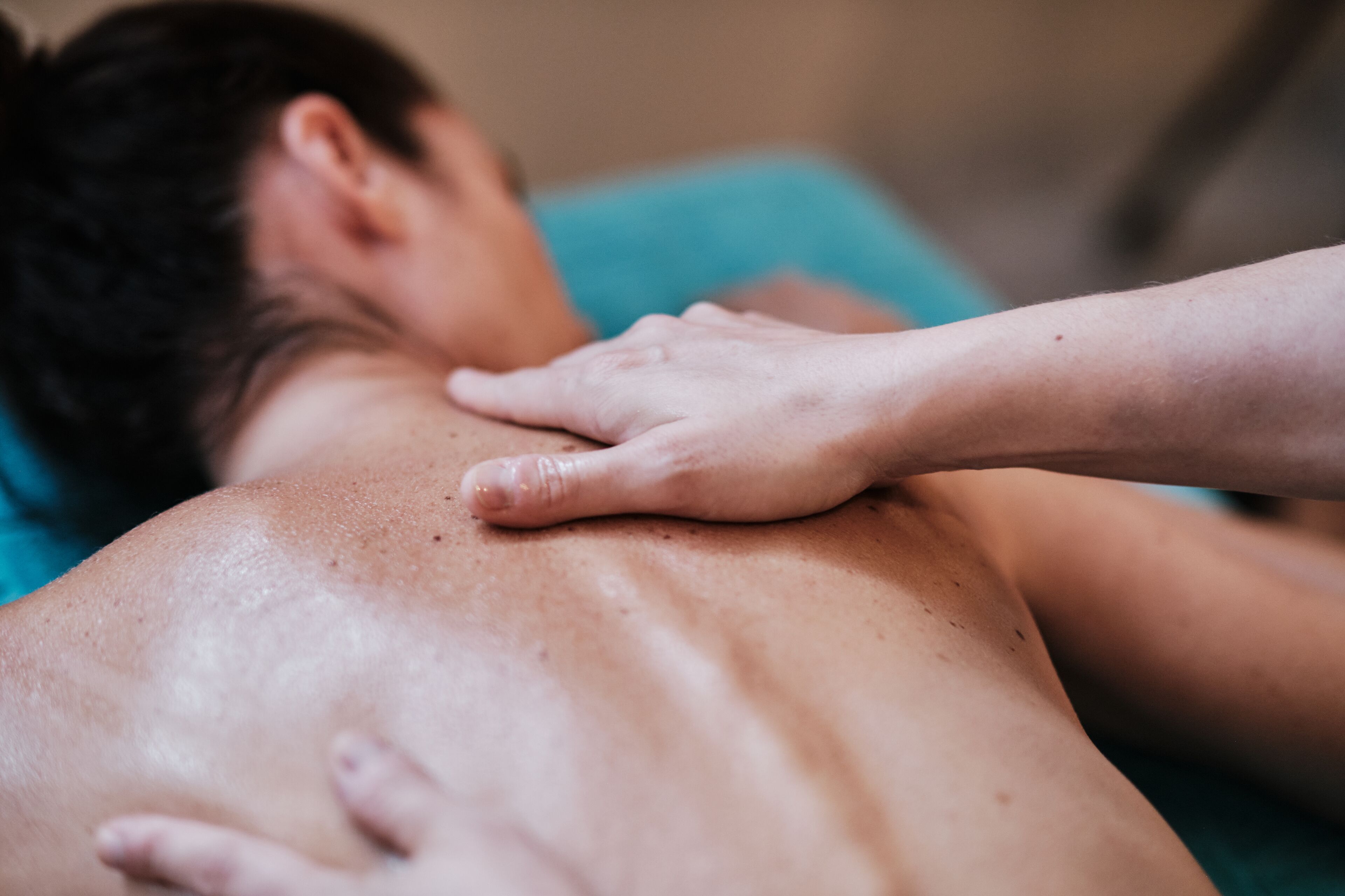 A person receiving a back massage.
