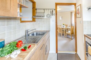 Fridge, microwave, oven, cookware/dishes/utensils