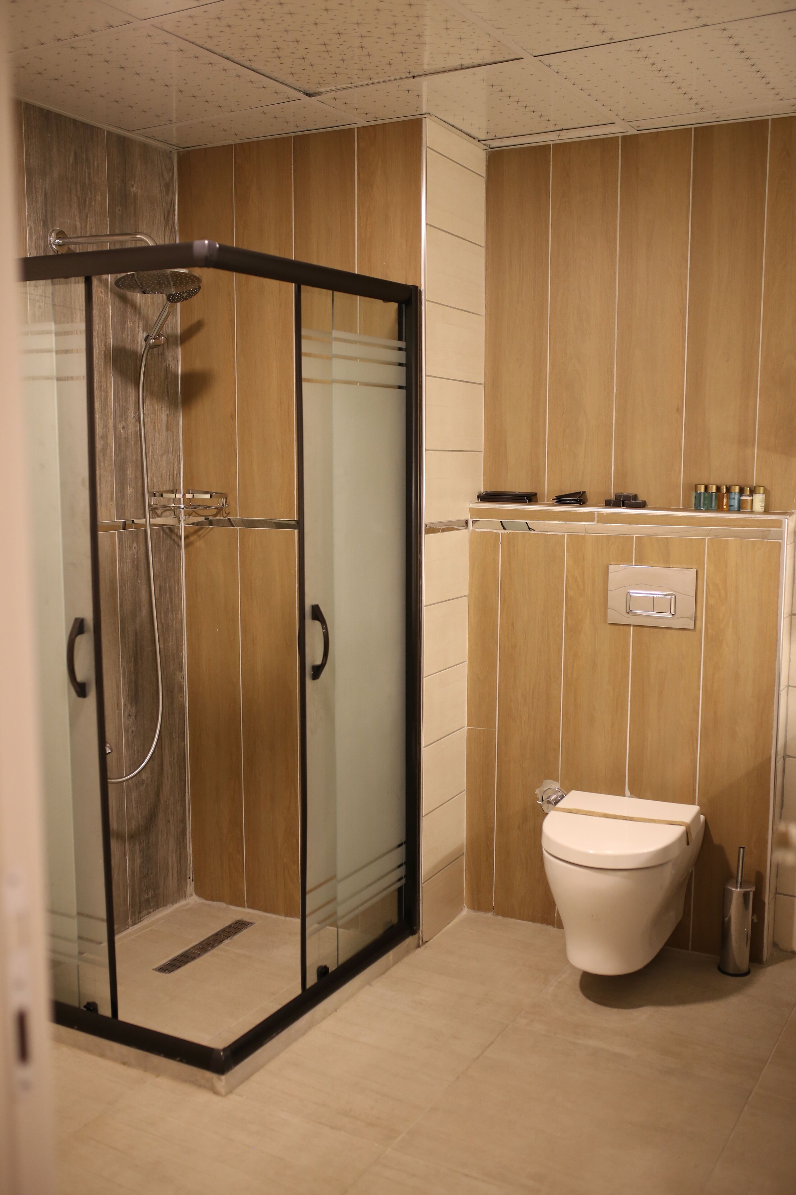 shower, rainfall showerhead, hair dryer, slippers