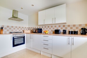 Fridge, microwave, oven, cookware/dishes/utensils