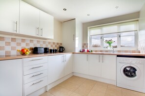 Fridge, microwave, oven, cookware/dishes/utensils