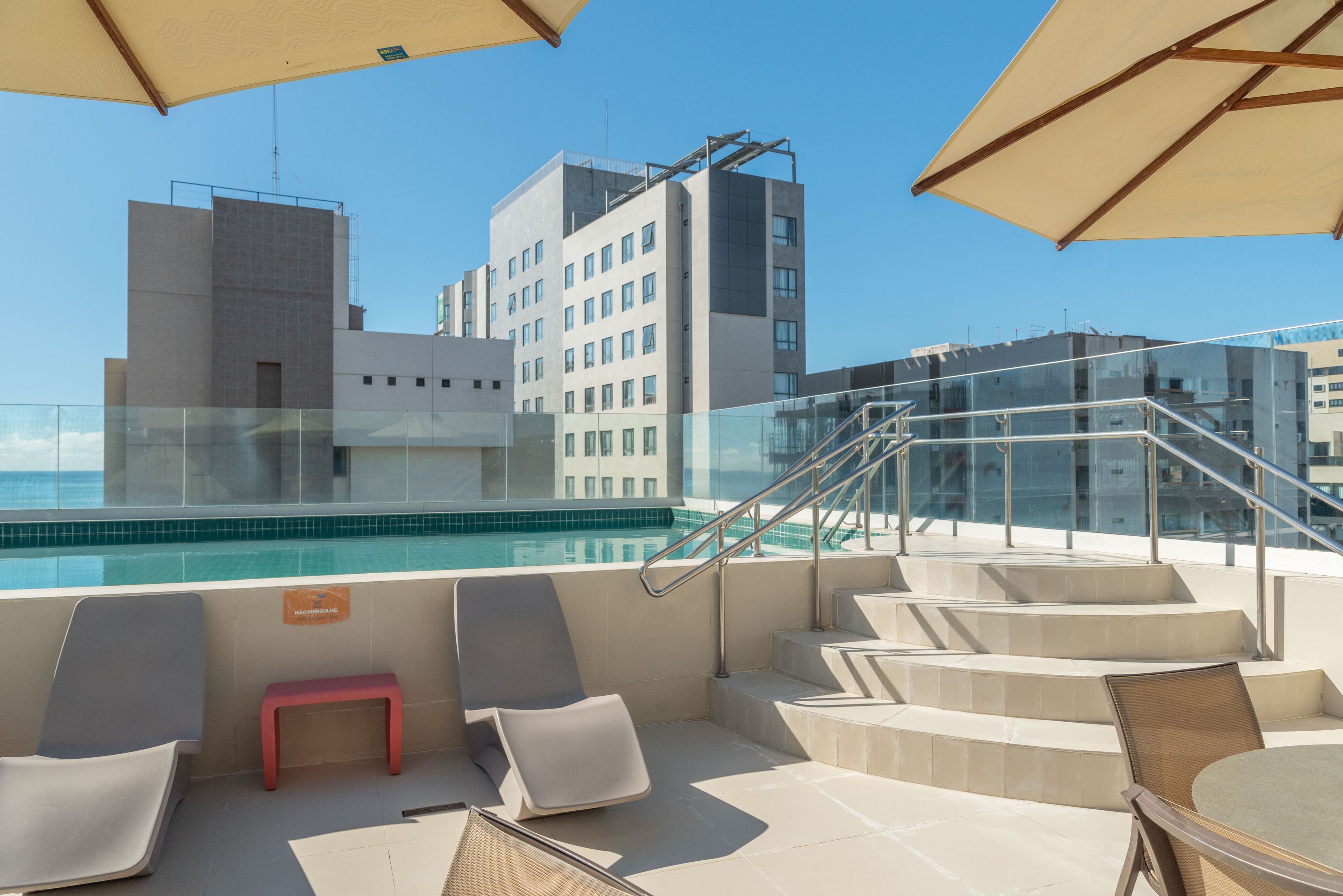 outdoor pool, pool umbrellas, pool loungers