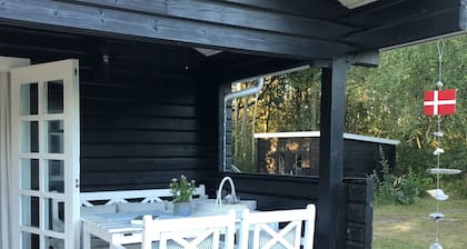 Lovely log house next to protected plantation