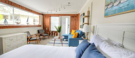 Studio suite with queen sized bed, full sized fold down sofa, 52" smart TV, and kitchenette with dinette for 4.