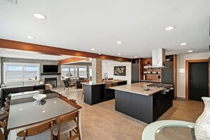 The Compass Suite Dining Area (Sits 10 plus 4 island counter seating places) - Compass 2BR Suite - Gourmet Kitchen - Water view (Cocoa Beach)