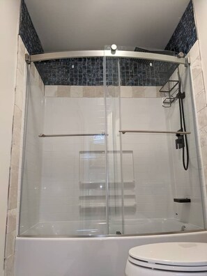 Combined shower/tub, hair dryer, towels, soap