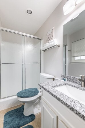 Combined shower/tub, hair dryer, towels, soap