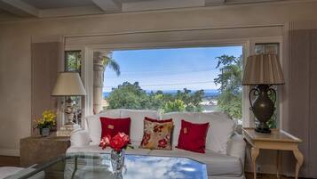 House, Multiple Beds, Balcony, Partial Ocean View | Living room | 40-inch TV with cable channels, fireplace