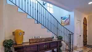 A staircase with a sign reading "BEACH" leading to a door. - Luxurious Mykonos - Pet Friendly (Santa Barbara)