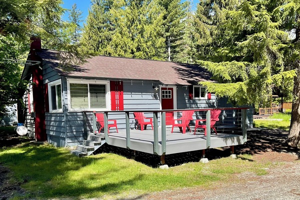 Nestled in a lakeside neighborhood and stands apart with the front yard deck.